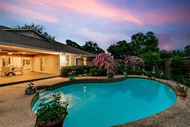 a view of a swimming pool with lounge chair