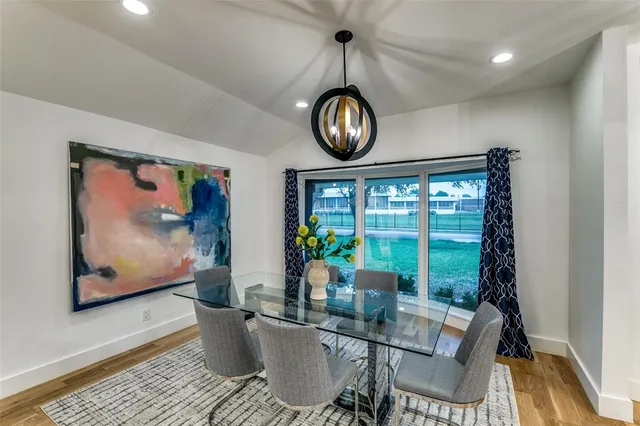 a view of a dining room with furniture window and chandelier