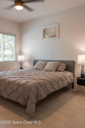 a bedroom with a bed and window