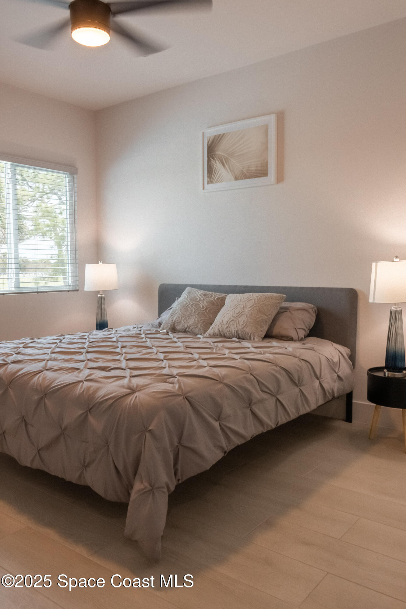 2148 Country Club Road Melbourne, FL 32901 - Photo 24 of 30 a bedroom with a bed and window