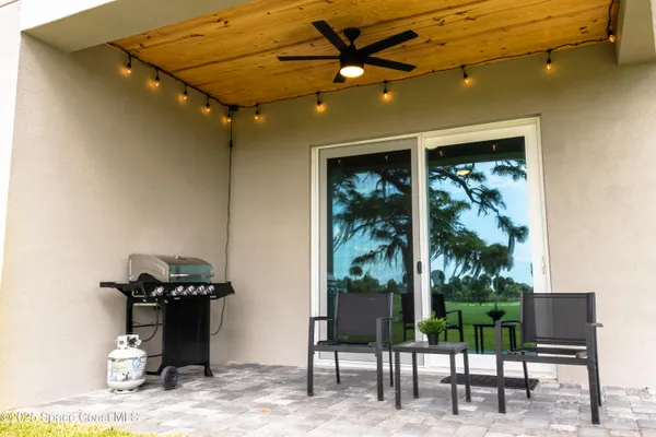a view of a porch with seating space