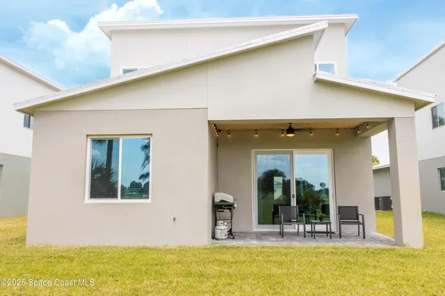 a view of swimming pool with outdoor seating
