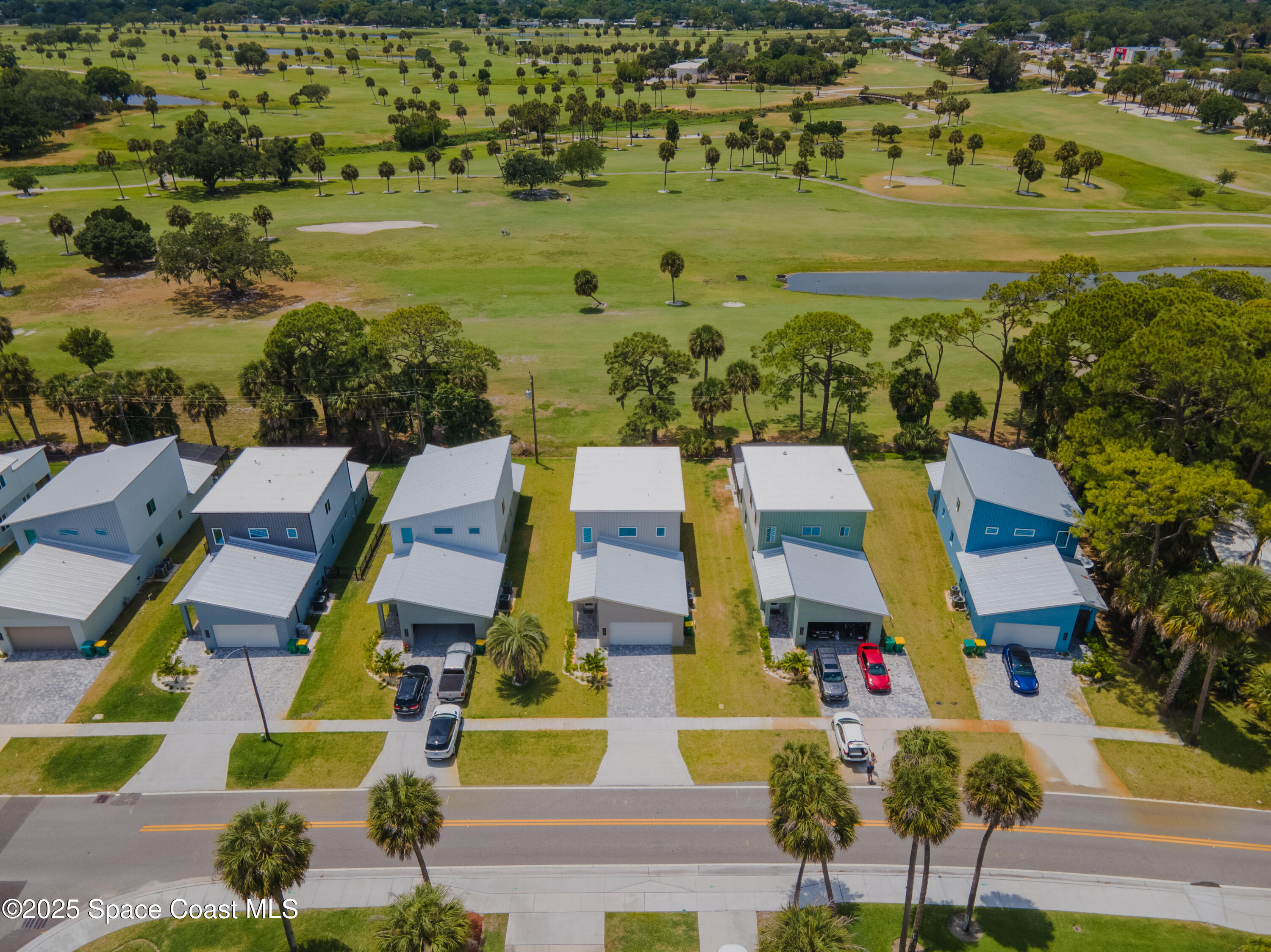2148 Country Club Road Melbourne, FL 32901 - Photo 3 of 30 an aerial view of residential building with outdoor space and ocean view