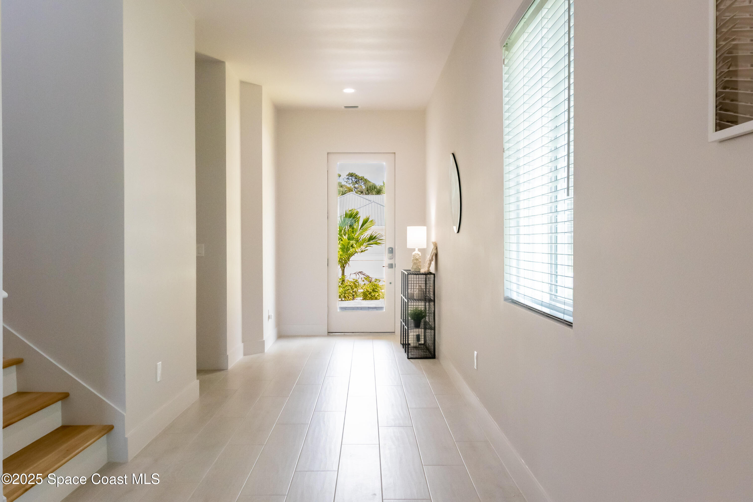 2148 Country Club Road Melbourne, FL 32901 - Photo 6 of 30 a view of an entryway with wooden floor