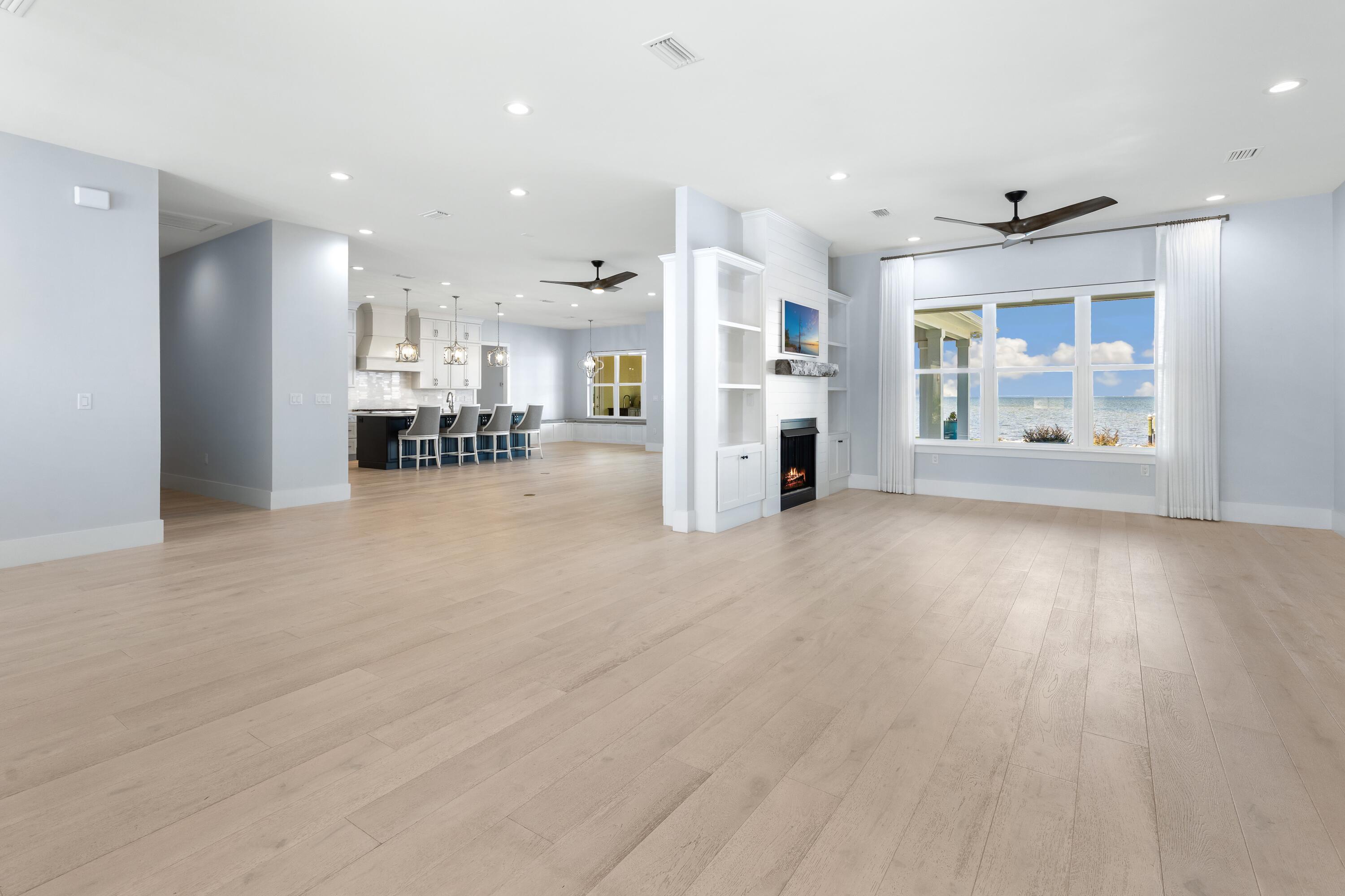 399 Driftwood Point Road Santa Rosa Beach, FL 32459 - Photo 11 of 94 a view of a kitchen with furniture and wooden floor