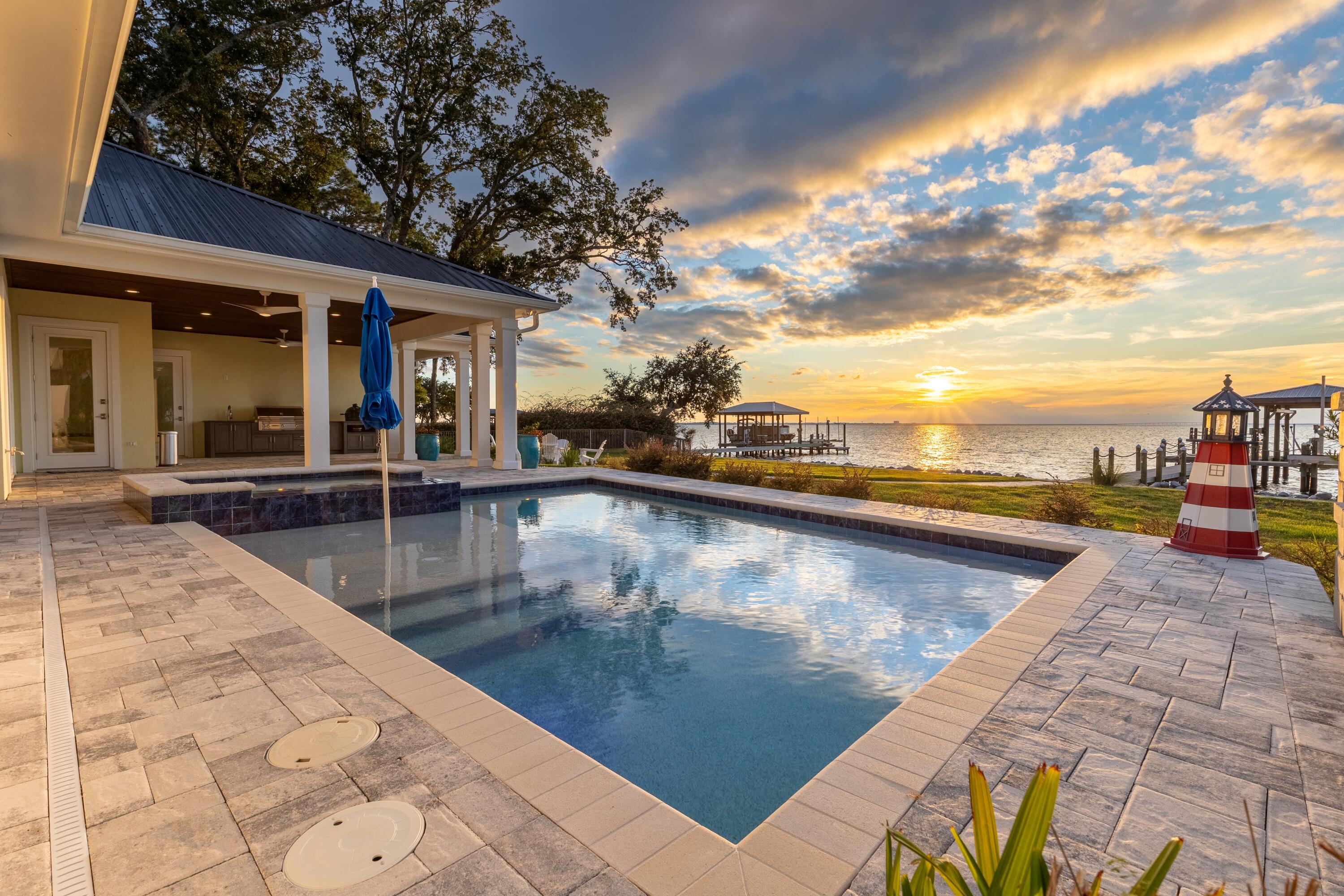 399 Driftwood Point Road Santa Rosa Beach, FL 32459 - Photo 4 of 94 a view of a swimming pool with an outdoor seating