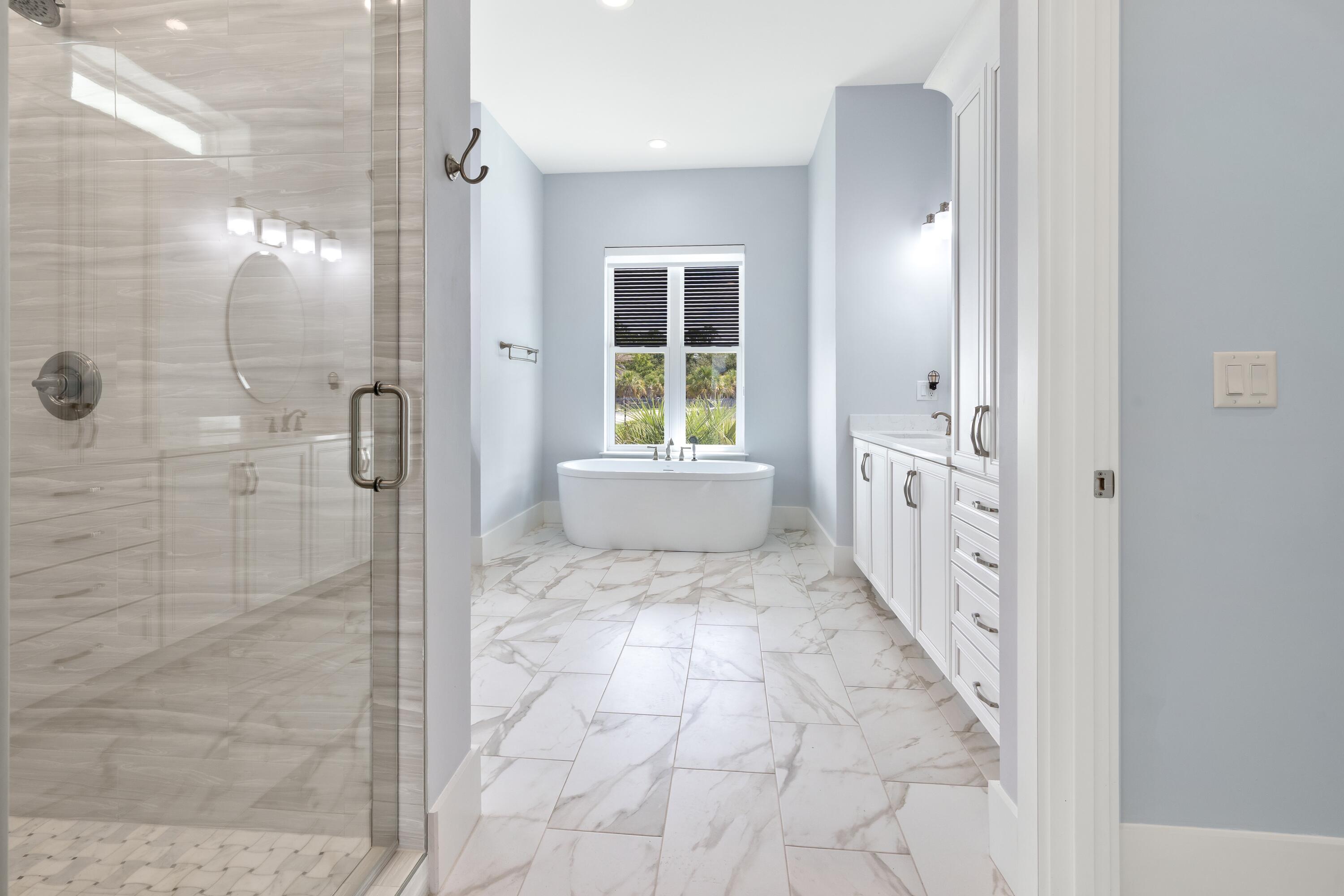 399 Driftwood Point Road Santa Rosa Beach, FL 32459 - Photo 47 of 94 a bathroom with a glass door shower