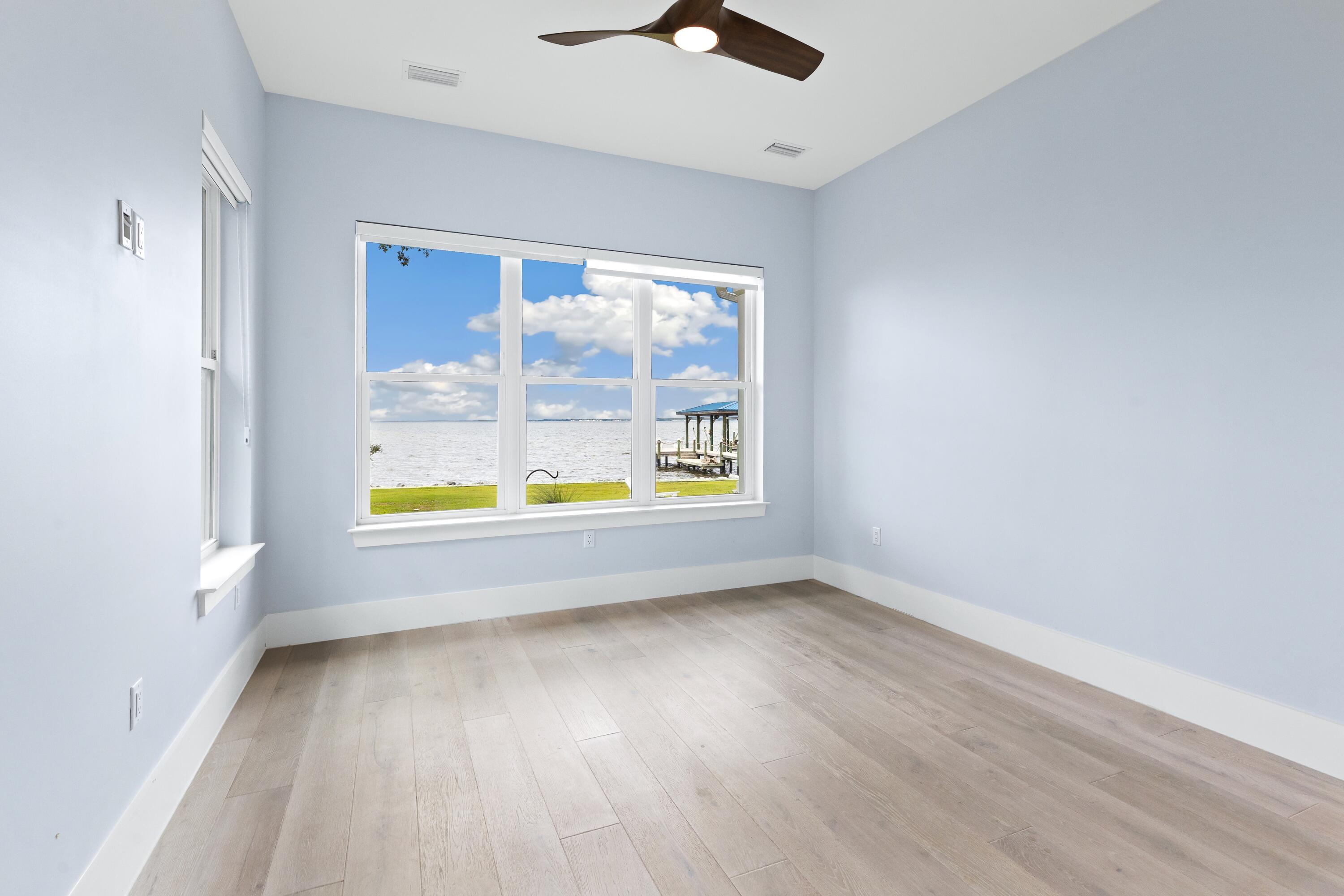 399 Driftwood Point Road Santa Rosa Beach, FL 32459 - Photo 53 of 94 wooden floor in an empty room
