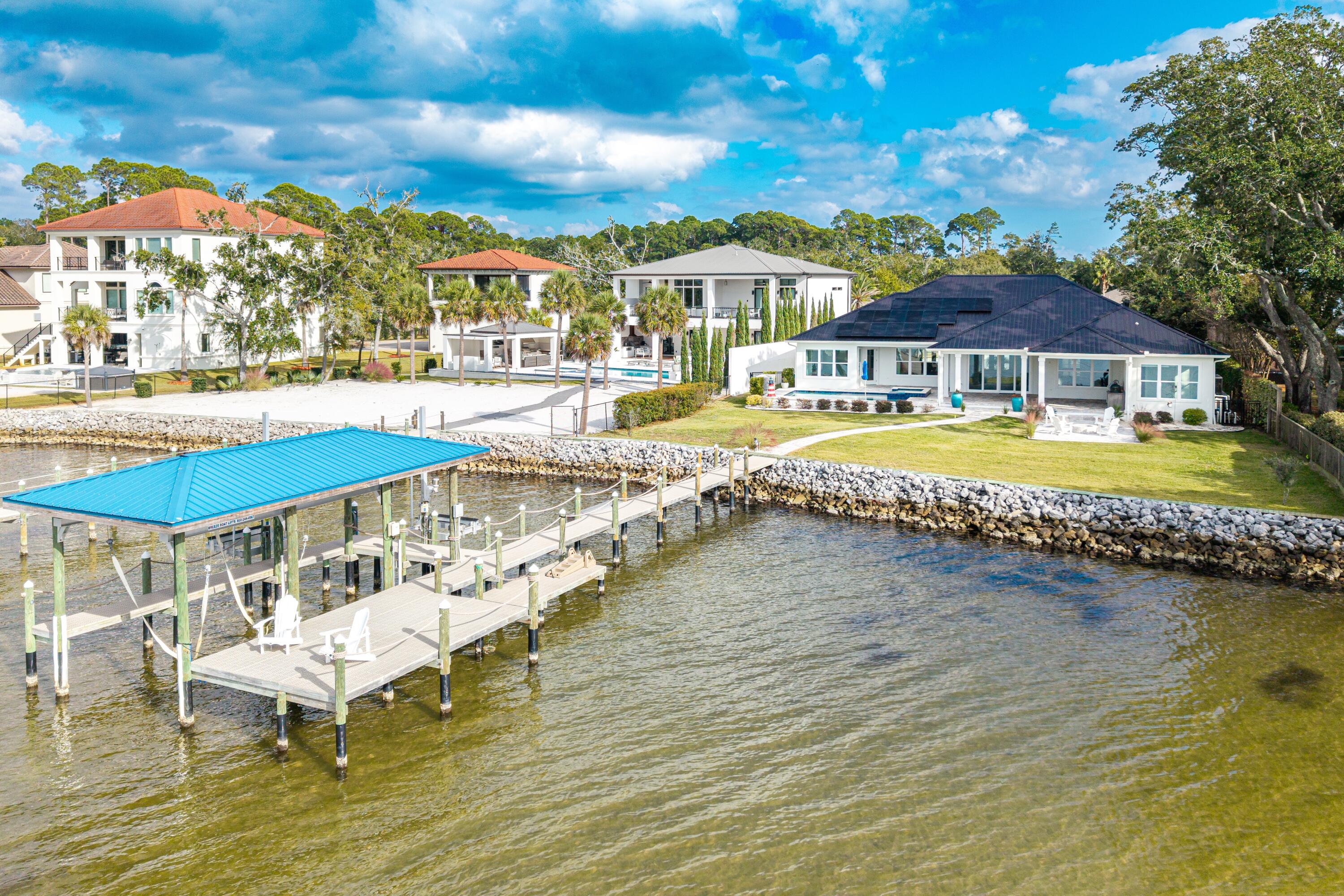 399 Driftwood Point Road Santa Rosa Beach, FL 32459 - Photo 70 of 94 a swimming pool with outdoor seating and yard