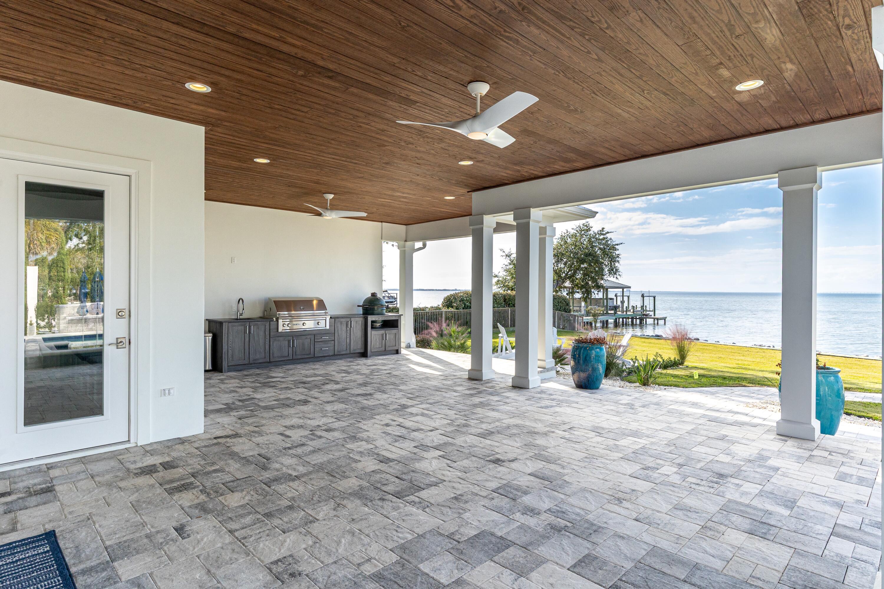399 Driftwood Point Road Santa Rosa Beach, FL 32459 - Photo 77 of 94 a view of a hall with a floor to ceiling window and an empty room