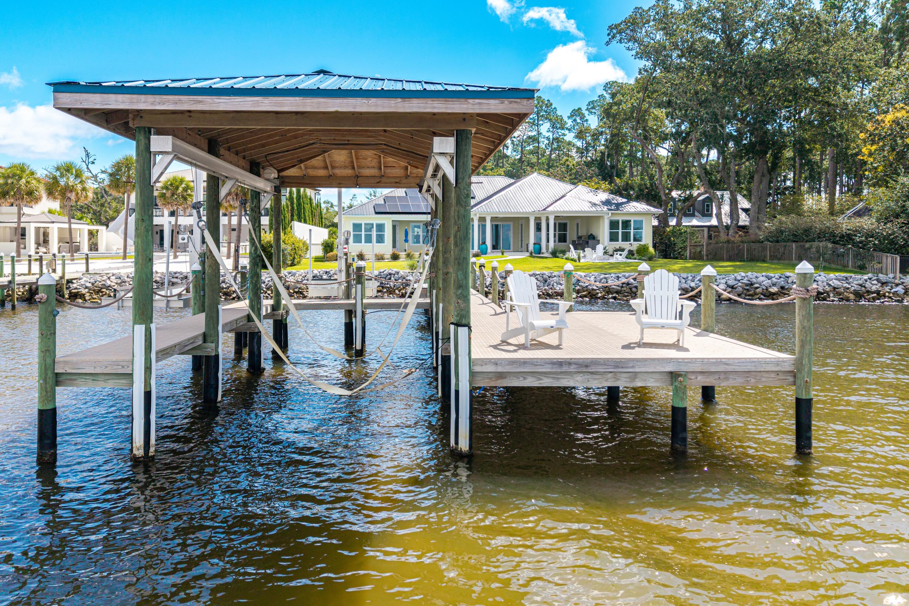 399 Driftwood Point Road Santa Rosa Beach, FL 32459 - Photo 10 of 94 a view of a swimming pool with a patio
