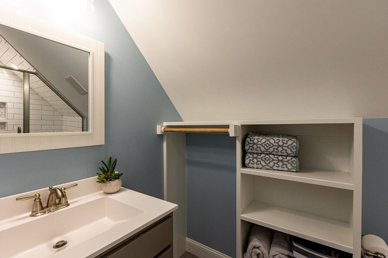 117 Kingsport Road Holly Springs, NC 27540 - Photo 20 of 41 Recently added full bath with designer tile and space for hanging clothes. Bathroom