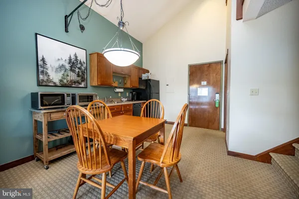 a view of a dining room with furniture