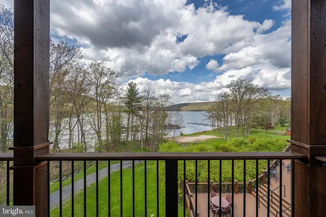 a view of a balcony with wooden fence