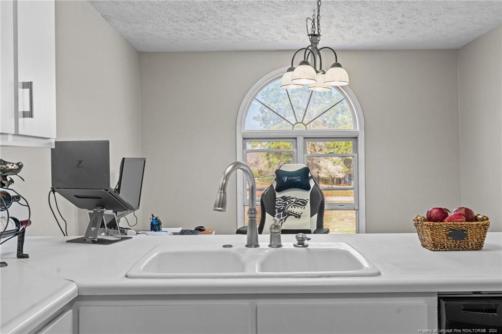124 East Lake Ridge Road Raeford, NC 28376 - Photo 16 of 44 a bathroom with a sink and a mirror