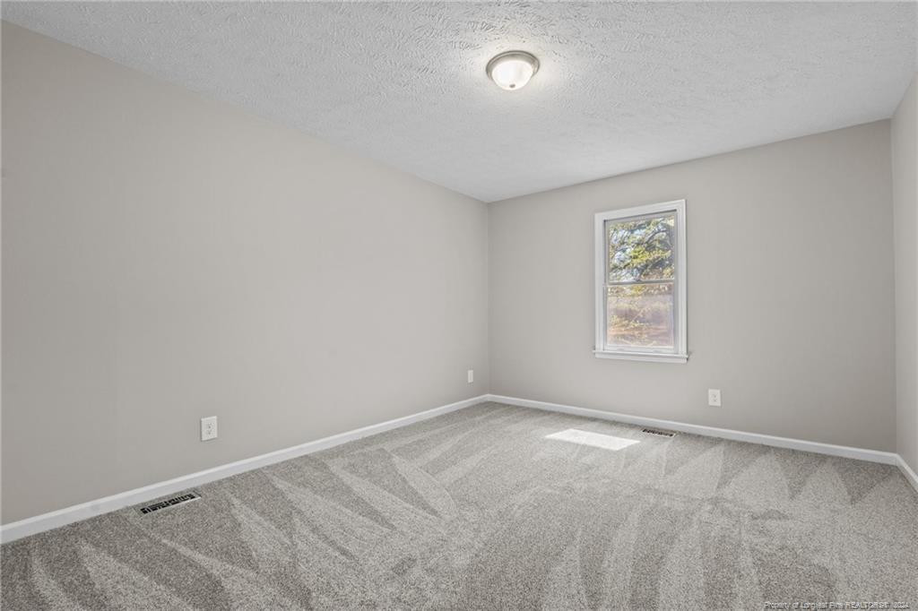124 East Lake Ridge Road Raeford, NC 28376 - Photo 30 of 44 an empty room with a window