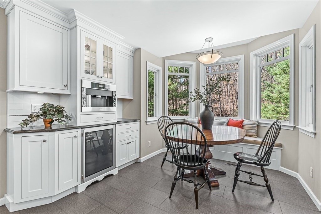 20 Algonquian Drive Natick, MA 01760 - Photo 14 of 40 a view of a dining room with furniture window and outside view
