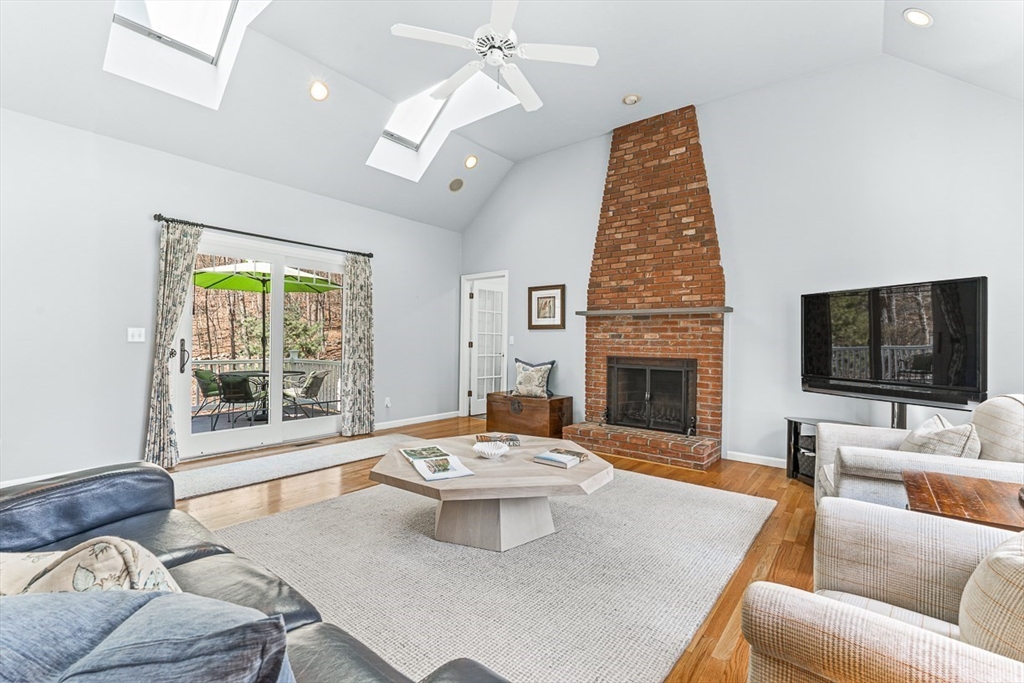 20 Algonquian Drive Natick, MA 01760 - Photo 16 of 40 a living room with furniture fireplace and a flat screen tv