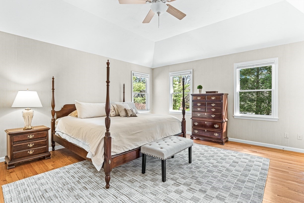 20 Algonquian Drive Natick, MA 01760 - Photo 20 of 40 a bedroom with a bed a lamp and a window