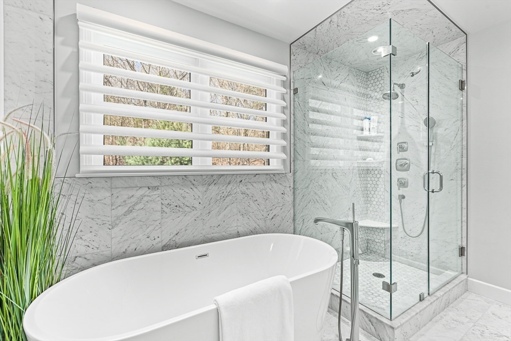 20 Algonquian Drive Natick, MA 01760 - Photo 23 of 40 a bathroom with a bathtub and a shower