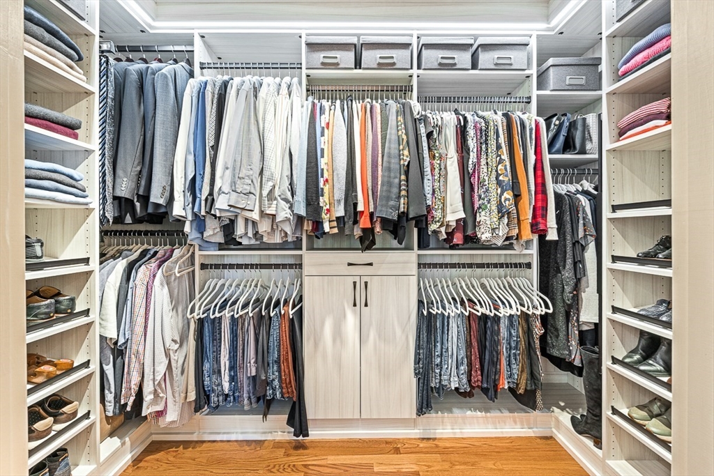 20 Algonquian Drive Natick, MA 01760 - Photo 25 of 40 a view of walk in closet with clothes and shoes