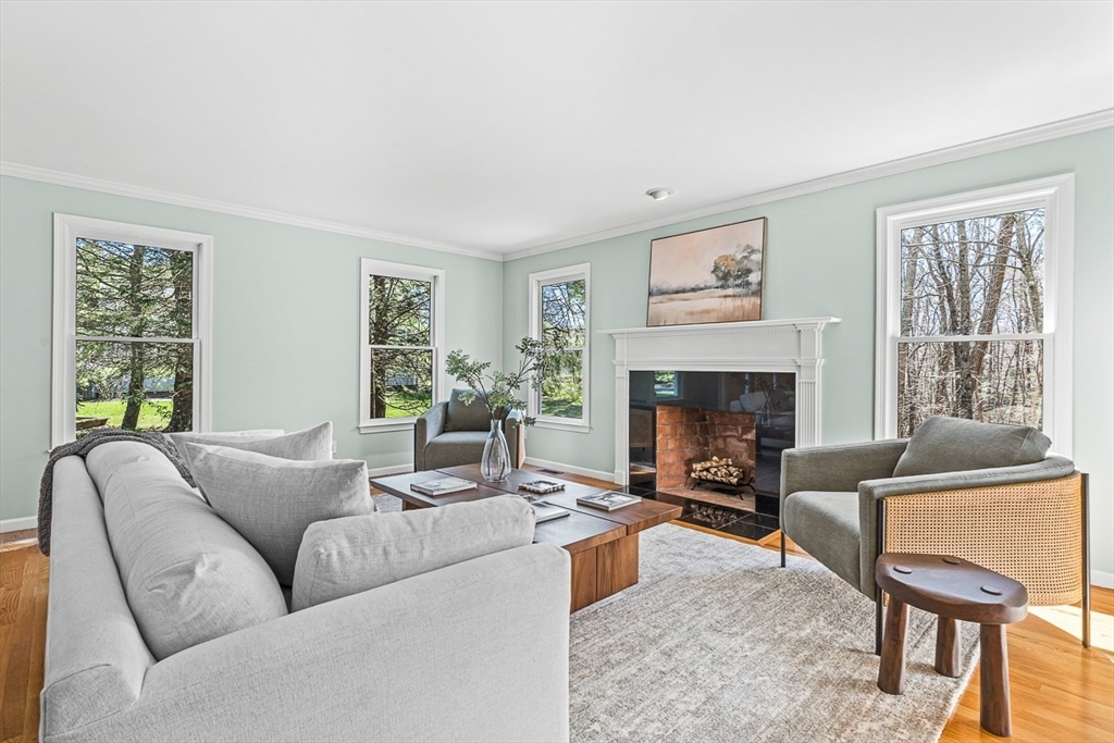 20 Algonquian Drive Natick, MA 01760 - Photo 3 of 40 a living room with furniture and a fireplace