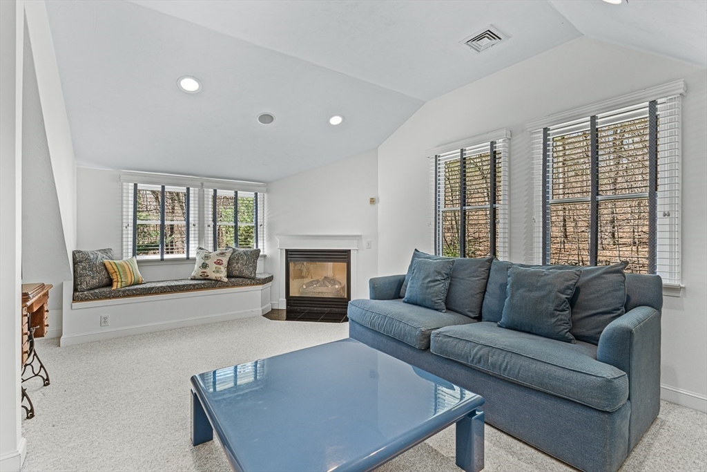 20 Algonquian Drive Natick, MA 01760 - Photo 34 of 40 a living room with furniture and a fireplace