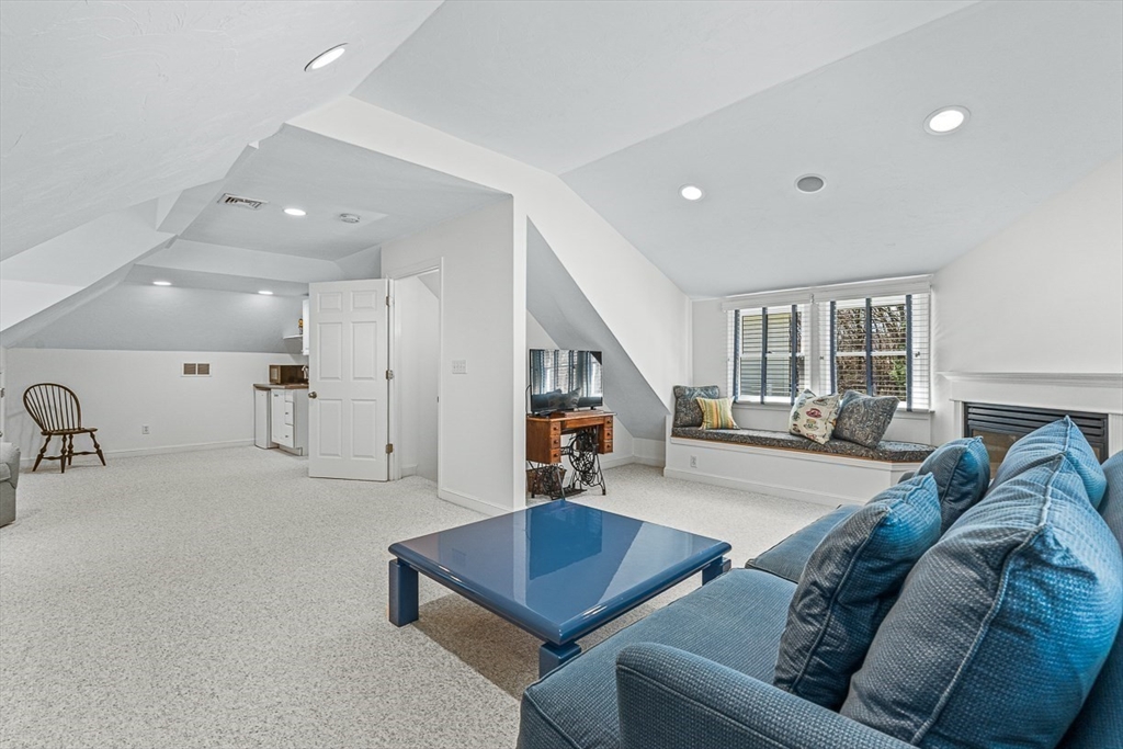 20 Algonquian Drive Natick, MA 01760 - Photo 35 of 40 a living room with furniture and a wooden floor