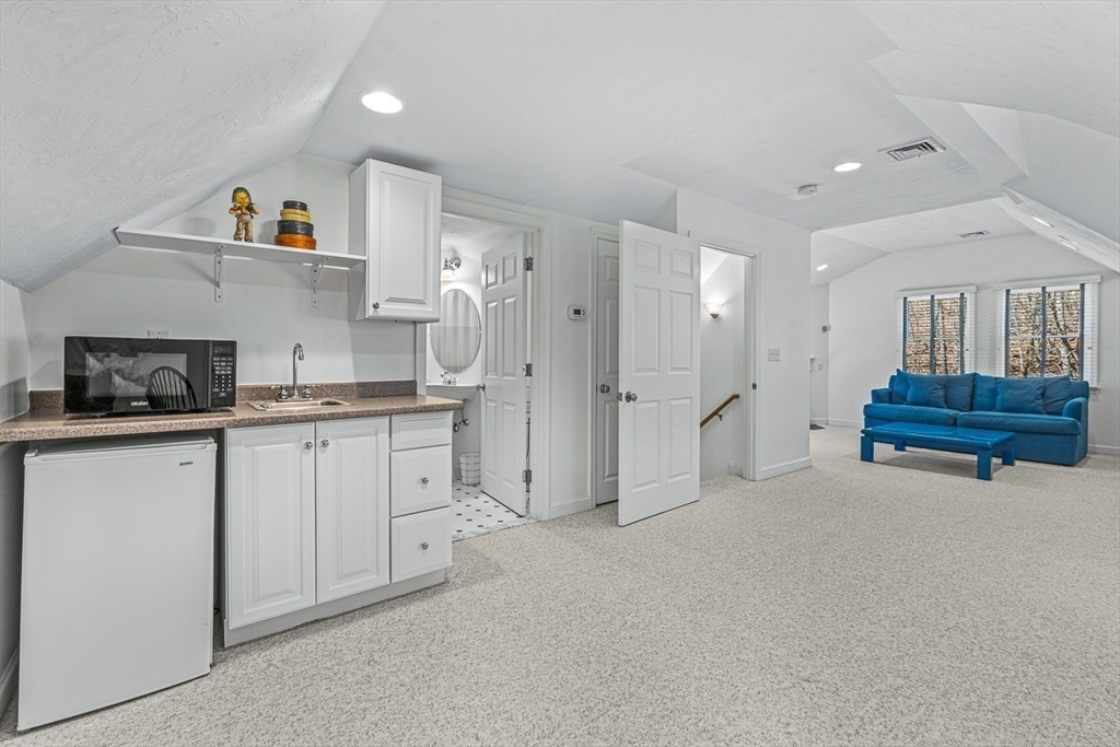 20 Algonquian Drive Natick, MA 01760 - Photo 36 of 40 a kitchen with refrigerator and cabinets