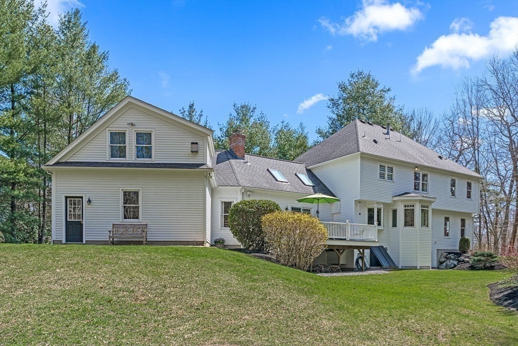 20 Algonquian Drive Natick, MA 01760 - Photo 40 of 40 a front view of a house with a garden and yard