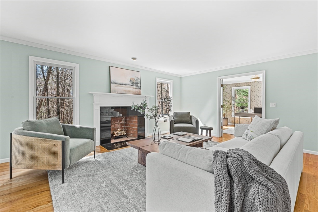 20 Algonquian Drive Natick, MA 01760 - Photo 4 of 40 a living room with furniture a window and a fireplace