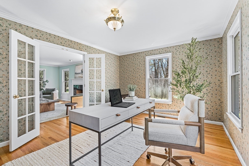 20 Algonquian Drive Natick, MA 01760 - Photo 6 of 40 a living room with furniture a flat screen tv and a table