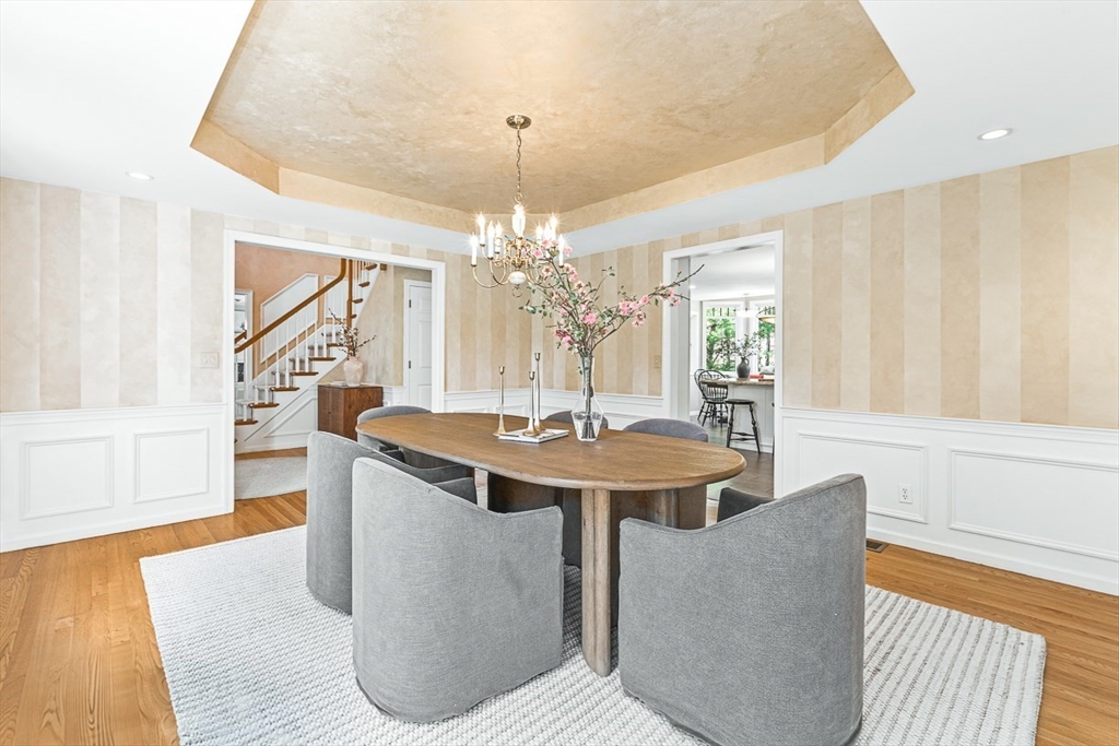 20 Algonquian Drive Natick, MA 01760 - Photo 7 of 40 a view of a living room and chandelier