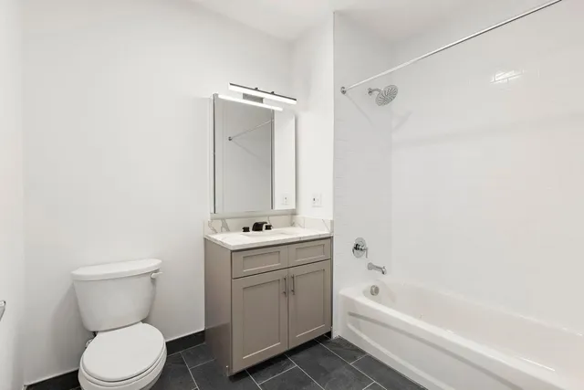 a bathroom with a toilet sink and bathtub