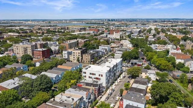 an aerial view of a city with lots of residential buildings