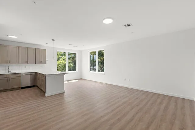 a view of kitchen and wooden floor