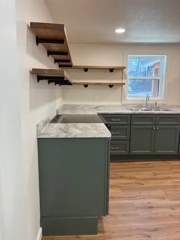 a kitchen with a sink and cabinets