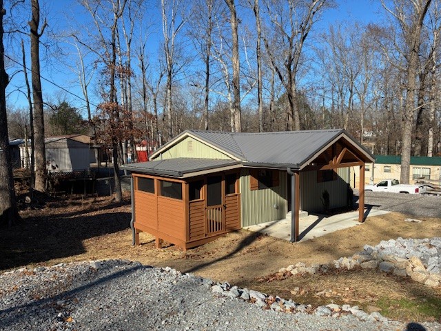 50 Gracy Drive Springville, TN 38256 - Photo 7 of 19 a view of a house with a yard covered in snow