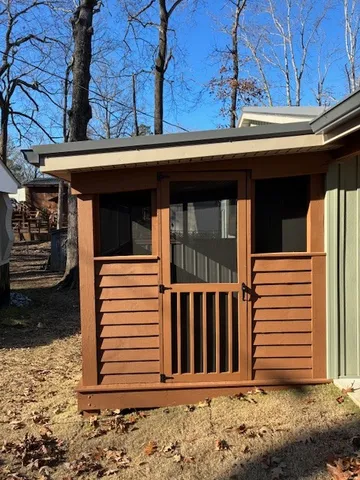 a view of a house with wooden fence
