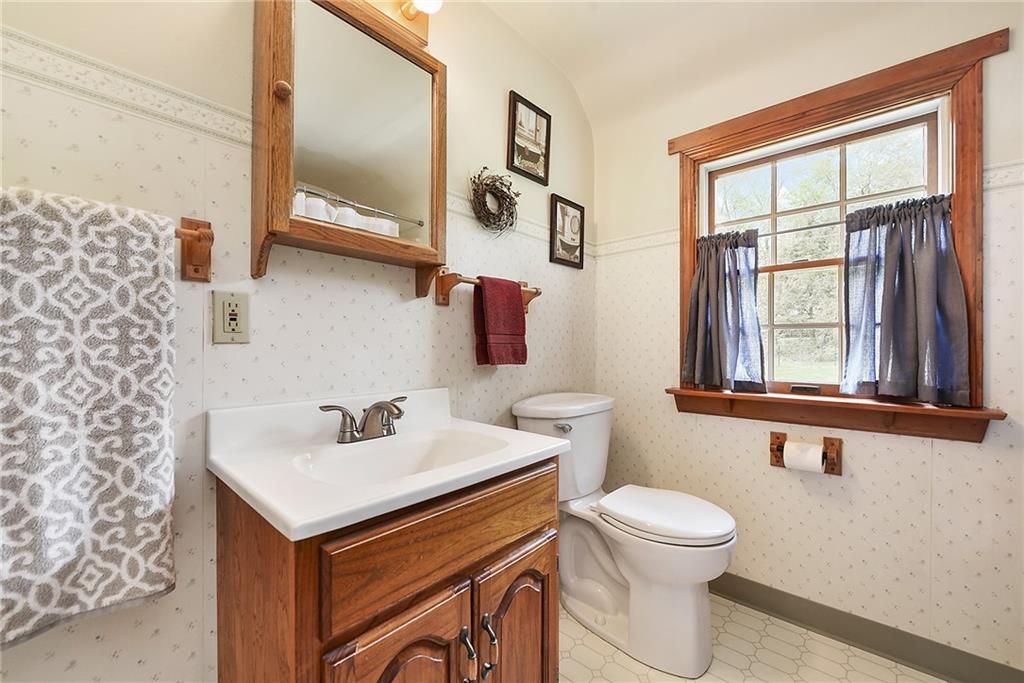 292 Moon Clinton Road Coraopolis, PA 15108 - Photo 23 of 34 a bathroom with a sink a toilet and a window