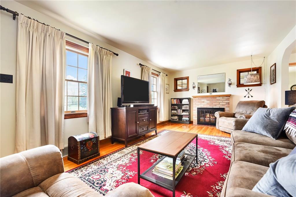 292 Moon Clinton Road Coraopolis, PA 15108 - Photo 3 of 34 a living room with furniture flat screen tv and a fireplace