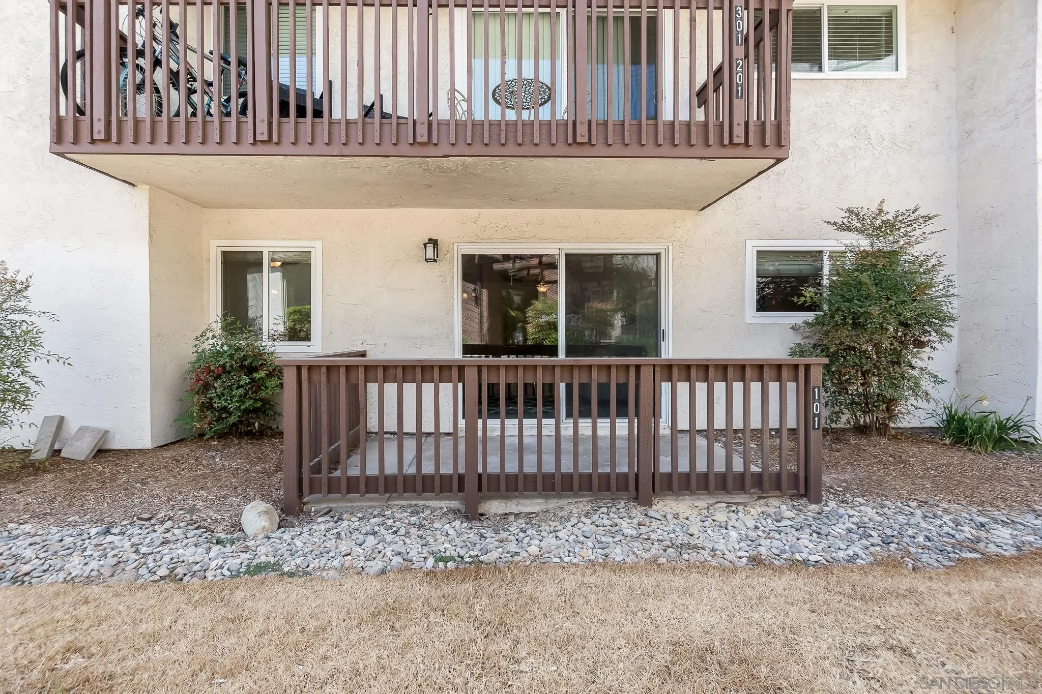 6111 Rancho Mission Road, Unit 101 San Diego, CA 92108 - Photo 20 of 30 a front view of a house with a porch