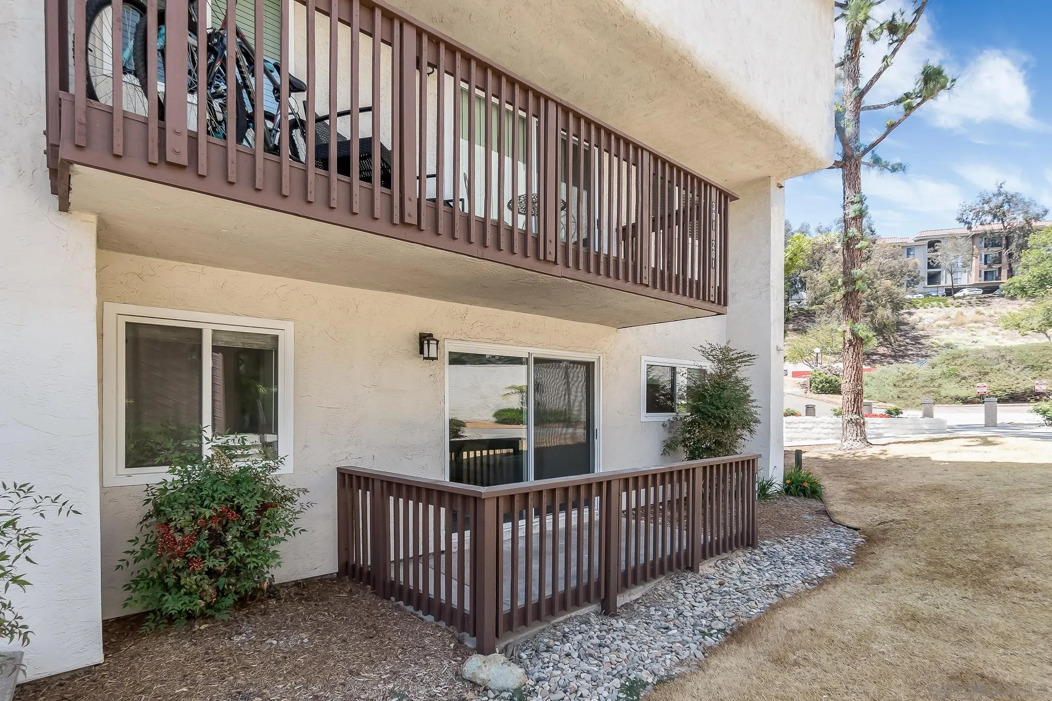 6111 Rancho Mission Road, Unit 101 San Diego, CA 92108 - Photo 21 of 30 a view of a house with a porch