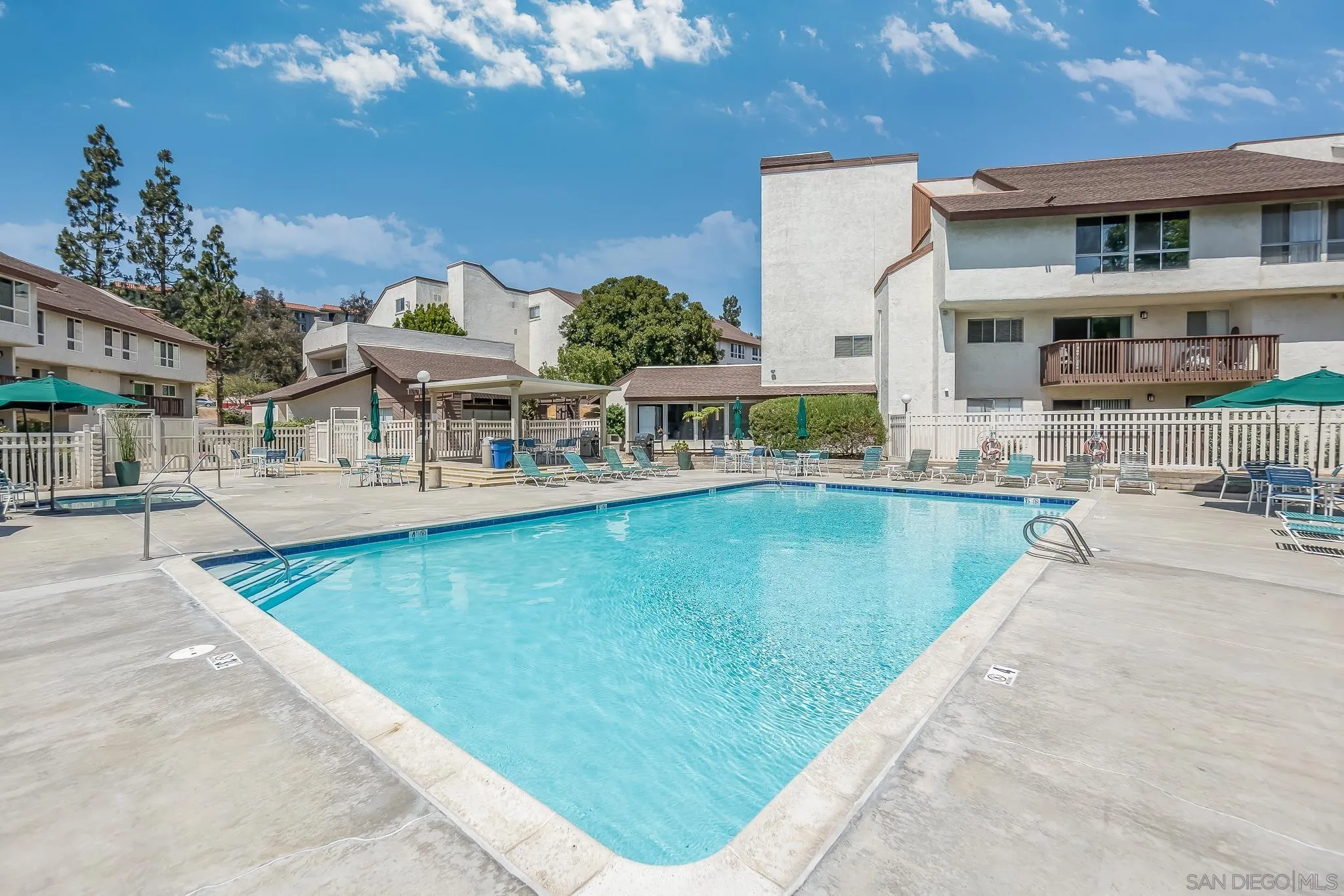 6111 Rancho Mission Road, Unit 101 San Diego, CA 92108 - Photo 25 of 30 a view of a house with a swimming pool