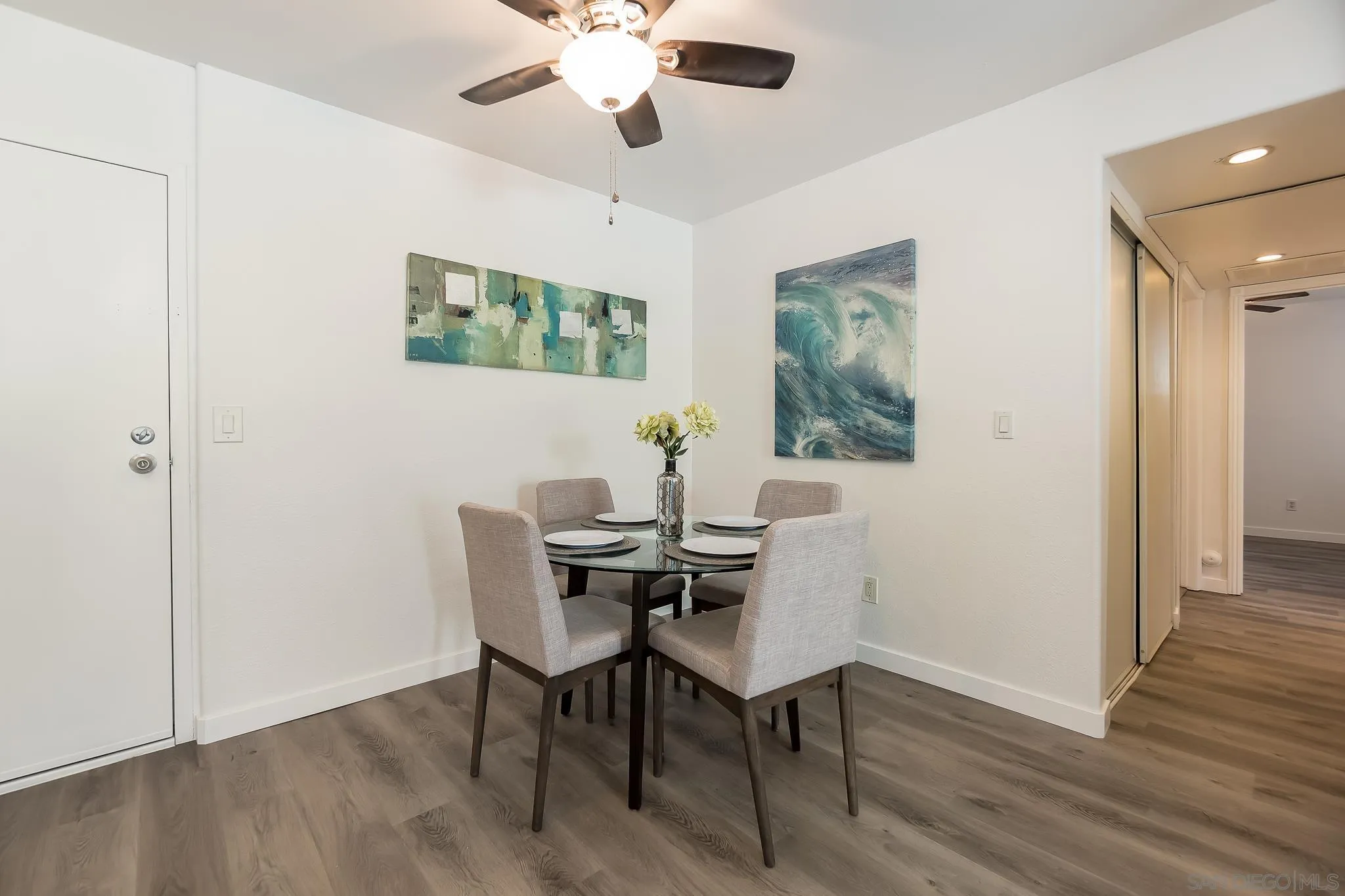 6111 Rancho Mission Road, Unit 101 San Diego, CA 92108 - Photo 9 of 30 a view of a dining room with furniture and wooden floor