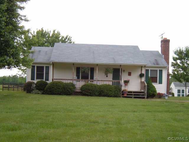 100 Jackson Road Bumpass, VA 23024 - Photo 1 of 1 a front view of a house with a garden