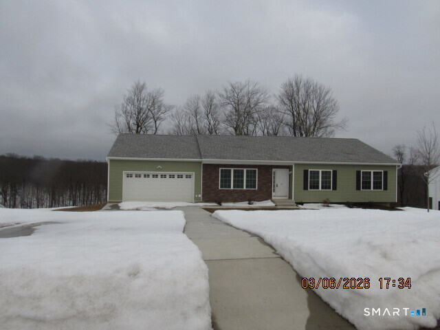57 Warm Earth Road Naugatuck, CT 06770 - Photo 2 of 24 a front view of a house with a yard
