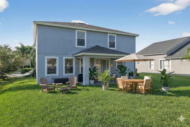 a front view of a house with garden and porch