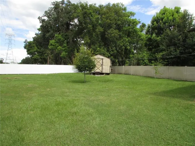 a backyard of a house with lots of green space