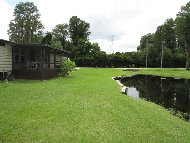 a view of a lake with a big yard